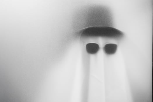 Mysterious Ghostly Figure in Black Sunglasses.Eerie and Minimalistic Halloween Concept at Bangkok, Thailand. photo