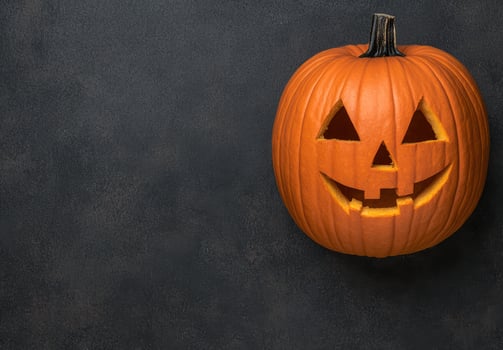 Carved halloween pumpkin with scary face photo