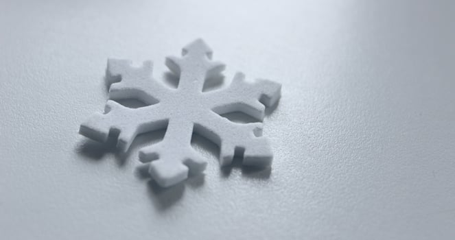 Winter Is Coming. Snowflake Isolated On Cold White Surface Angle View. Decorative Snowflake On White Copy Space Stock Photo