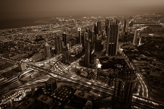 Dubai downtown night scene with city lights. Top view photo