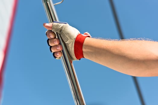 Sailors hand on a sailboat photo