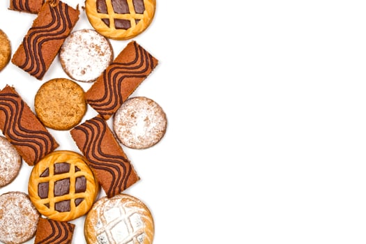 Cake bars filled with cream, oat cookies and tarts with dark chocolate isolated on white background. photo