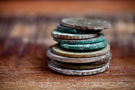 Stack of different ancient copper coins with patina. photo