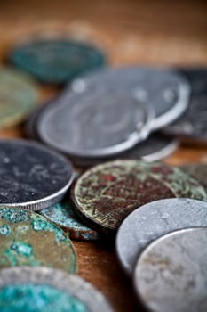 Tarnished and partially corroded old copper coins photo