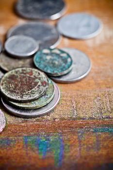 Pile of different ancient copper coins with patina. photo