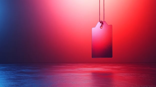 A red and blue price tag hanging from a string photo