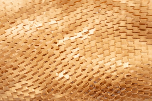 Eco friendly brown paper honeycomb texture wrap background for product packaging parcel carton box photo