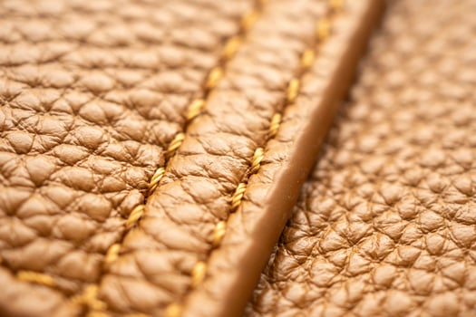 luxury brown leather bag texture background with stitching photo