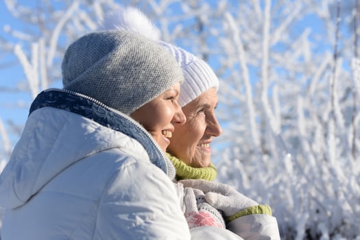 Beautiful elderly woman and her daughter enjoy winter together. photo