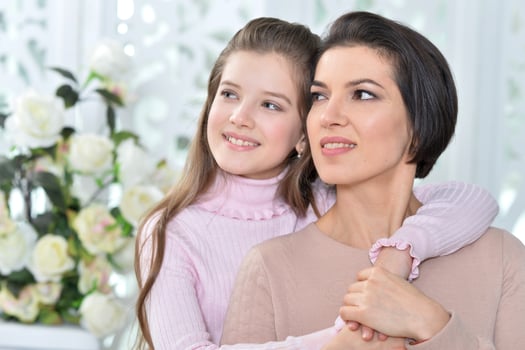 Little girl with her mother posing at home photo