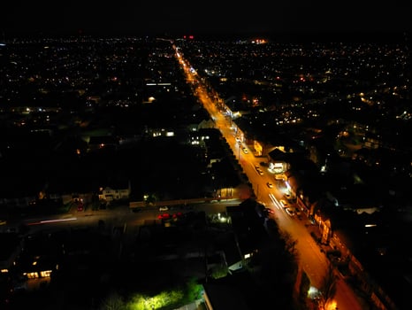 Aerial View of Illuminated Central Cambridge City of Cambridgeshire of England UK During Night. High Angle Footage Was Captured with Drone's Camera at Just After Sunset on March 22nd, 2024 photo