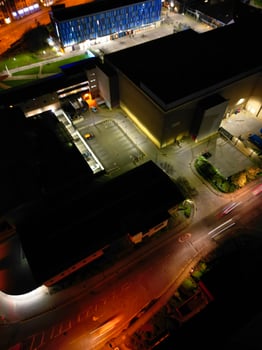 Aerial View of Illuminated Central Cambridge City of Cambridgeshire of England UK During Night. High Angle Footage Was Captured with Drone's Camera at Just After Sunset on March 22nd, 2024 photo