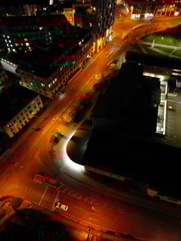 Aerial View of Illuminated Central Cambridge City of Cambridgeshire of England UK During Night. High Angle Footage Was Captured with Drone's Camera at Just After Sunset on March 22nd, 2024 photo