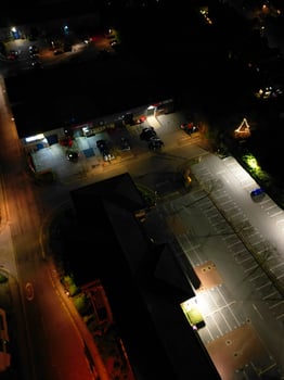 Aerial View of Illuminated Central Cambridge City of Cambridgeshire of England UK During Night. High Angle Footage Was Captured with Drone's Camera at Just After Sunset on March 22nd, 2024 photo