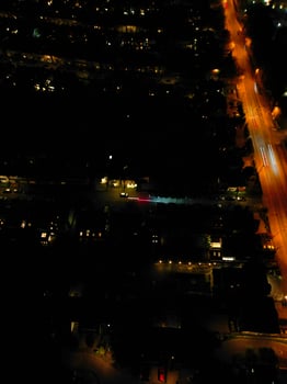 Aerial View of Illuminated Central Cambridge City of Cambridgeshire of England UK During Night. High Angle Footage Was Captured with Drone's Camera at Just After Sunset on March 22nd, 2024 photo