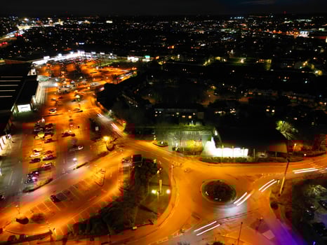 Aerial View of Illuminated Central Cambridge City of Cambridgeshire of England UK During Night. High Angle Footage Was Captured with Drone's Camera at Just After Sunset on March 22nd, 2024 photo
