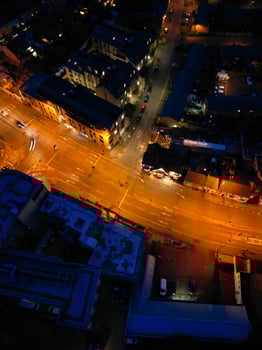 Aerial View of Illuminated Central Cambridge City of Cambridgeshire of England UK During Night. High Angle Footage Was Captured with Drone's Camera at Just After Sunset on March 22nd, 2024 photo