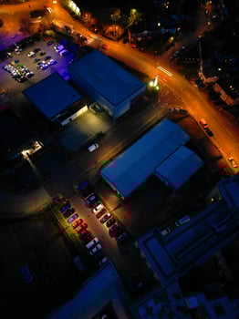 Aerial View of Illuminated Central Cambridge City of Cambridgeshire of England UK During Night. High Angle Footage Was Captured with Drone's Camera at Just After Sunset on March 22nd, 2024 photo