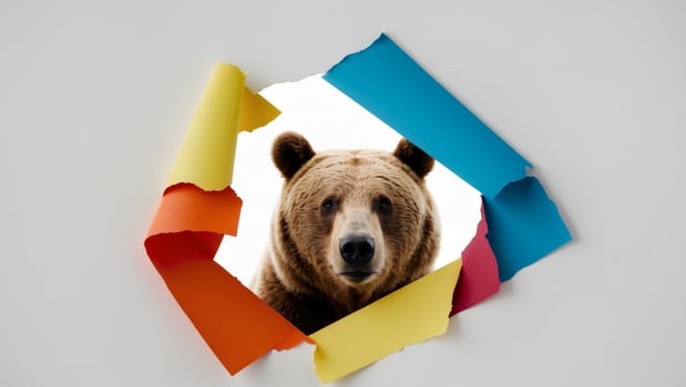 A brown bear is peeking out of a hole in a paper photo