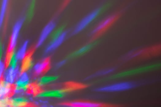 Multicolored highlights pink blue yellow on a lilac background photo