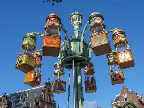 A large building with a large clock tower in nijmegen photo