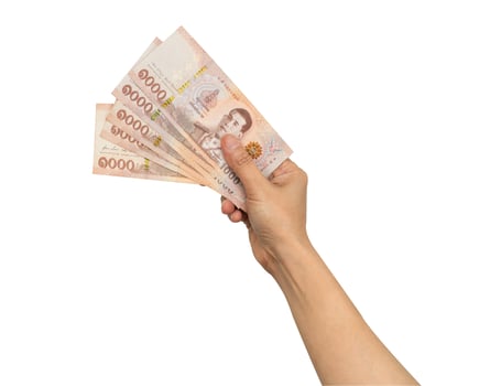 Asian woman holding Thai baht banknote money in hand isolated on white background with clipping path. photo
