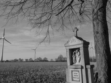A black and white photo of a wind turbine