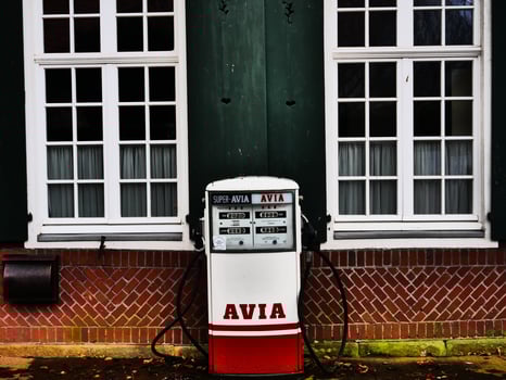 A red and white gas pump photo