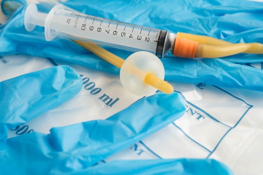 Foley catheter and urine drainage bag collect urine for disability or patient in hospital. photo