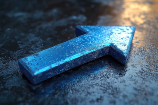 Blue metallic arrow pointing up representing growth on reflective background photo