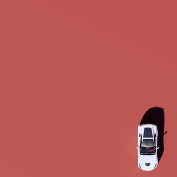 A white car on a red background photo