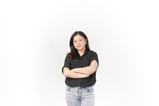 beautiful Asian woman stands with her arms folded across her chest, exuding confidence against a white background photo