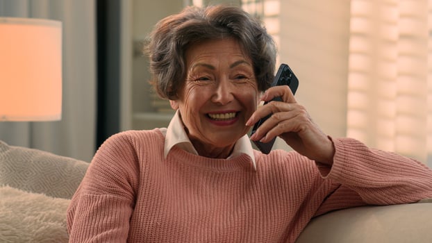 Happy laughing talking phone Caucasian old woman carefree senior lady listening funny news smile laugh retired grandma elderly female grandmother mobile conversation smartphone communication at home photo