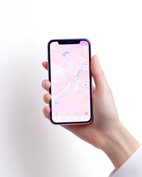 A person exploring a bright pink travel app on a smartphone while planning their next adventure photo