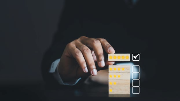 Business people are Choosing wood block with 5 star icon to give satisfaction in service. Feedback rating and positive customer review experience, service and Satisfaction. photo