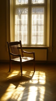 A solitary chair bathed in golden sunlight streaming through a window.. photo