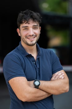 Portrait of a young successful entrepreneur in front of the company photo