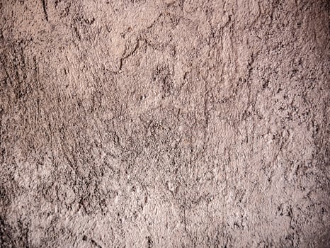 Wall background with rough surface due to unfinished wall plaster photo