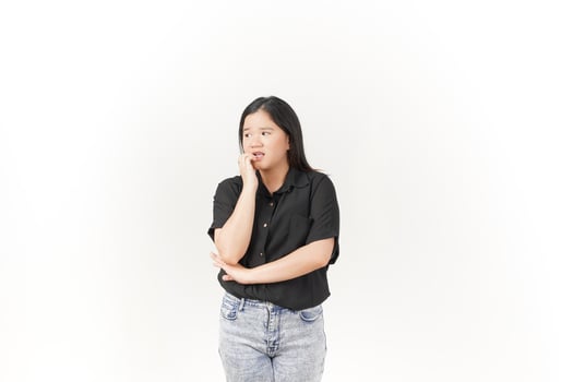 beautiful Asian woman looks scared, worried, and nervous, her expression full of anxiety against a white background photo