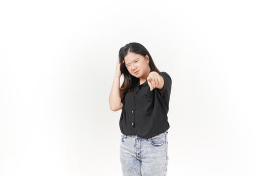 beautiful Asian woman holds her head in a headache pose, expressing discomfort against a white background photo