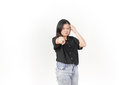beautiful Asian woman holds her head in a headache pose, expressing discomfort against a white background photo