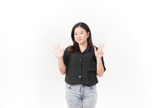 beautiful Asian woman poses with her hands to show the number 8 against a clean white background photo