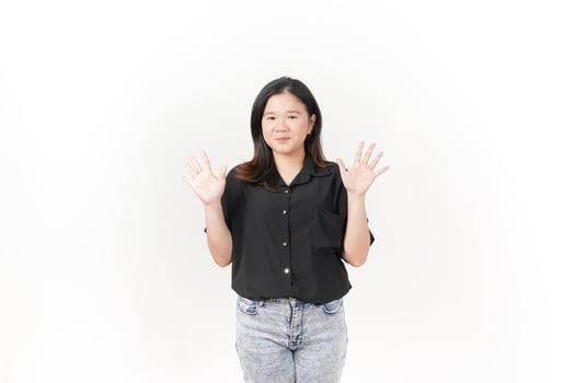 beautiful Asian woman poses with her hands, forming the number 10, against a clean white background photo