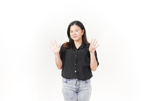 beautiful Asian woman poses with her hands to display the number 9 against a clean white background photo