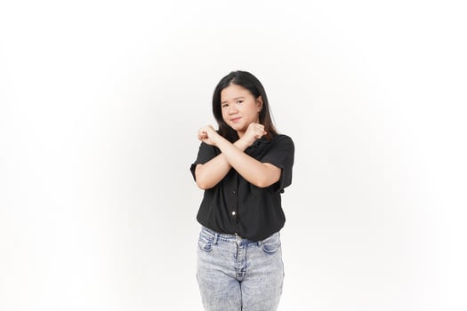 beautiful Asian woman poses with her hands raised in a 'no' gesture against a clean white background photo