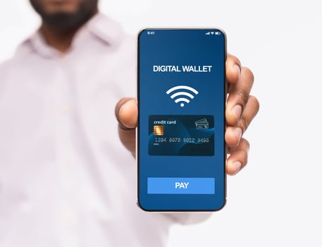 Mobile payment and modern cashless banking. Man holding smartphone with digital wallet application on screen, isolated on white background photo