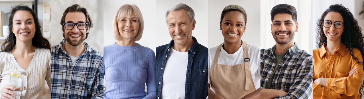 A diverse group of individuals stands side by side, all smiling warmly. They are in a well-lit space, suggesting a friendly workplace atmosphere, with varied attire reflecting their personalities. photo