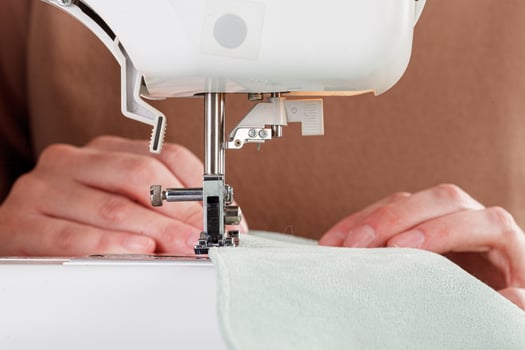 Sewing machine, stitching fabrics, needle in a round plan photo