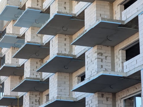 Construction of a new multi-storey building from the outside photo