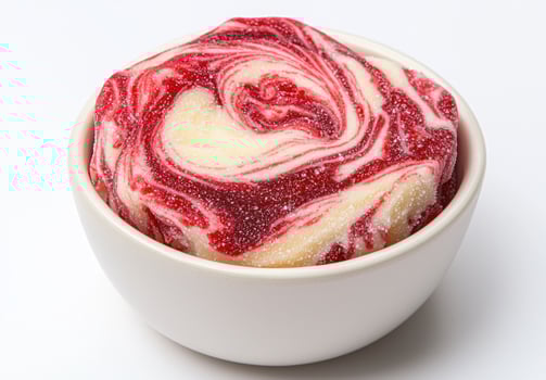 Swirled red and white dessert in a bowl photo